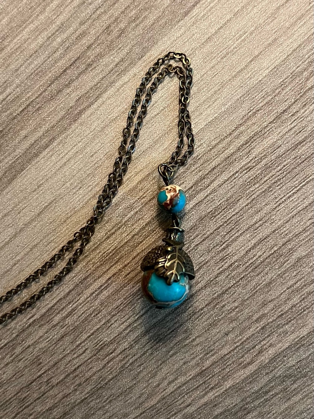 Turquoise and Antique Bronze Leaf Pendant Necklace